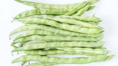 Pole beans over a white background