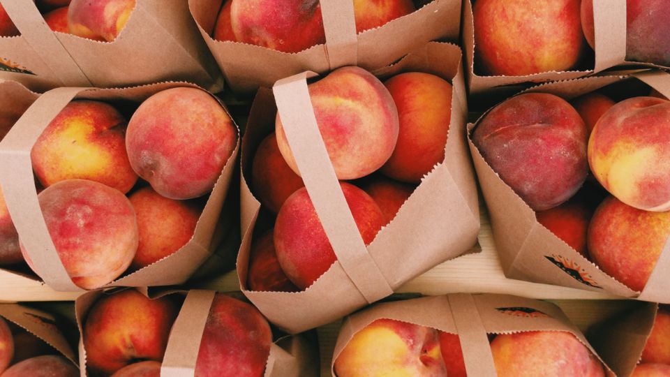 peaches in paper bags