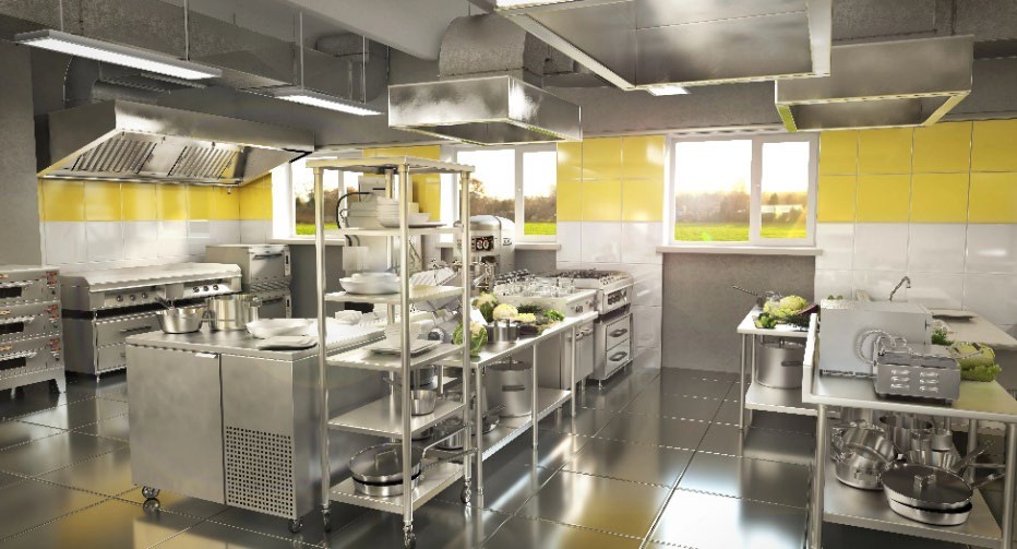 A commercial kitchen full of silver appliences.