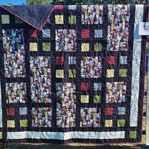 Wine bottle themed quilt for auction