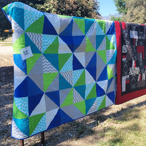 Teal and green patterned quilt