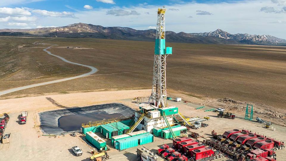Geothermal laboratory within an empty stretch of land surrounded by mountains.