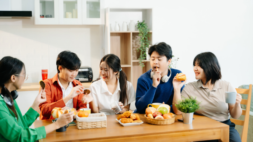Family eating meal together around a table