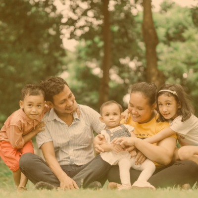 Family sitting on grass