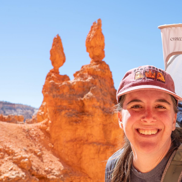 Woman smiling infront of Bryce Canyon Hoodoos
