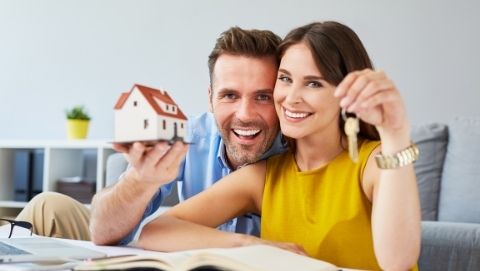 A couple holding a house key