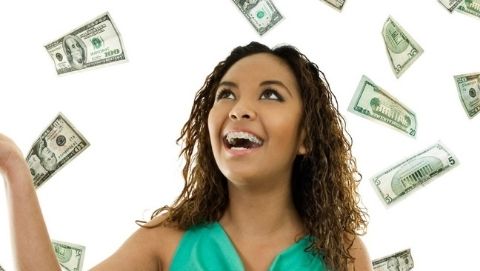 woman with money falling around her