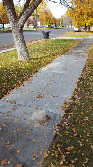 fixed sidewalk on 228 N. 300 W.