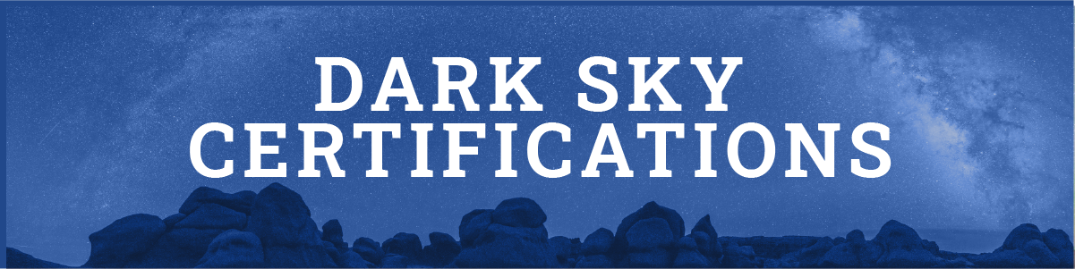 dark sky certifications with a background of boulder structures at night
