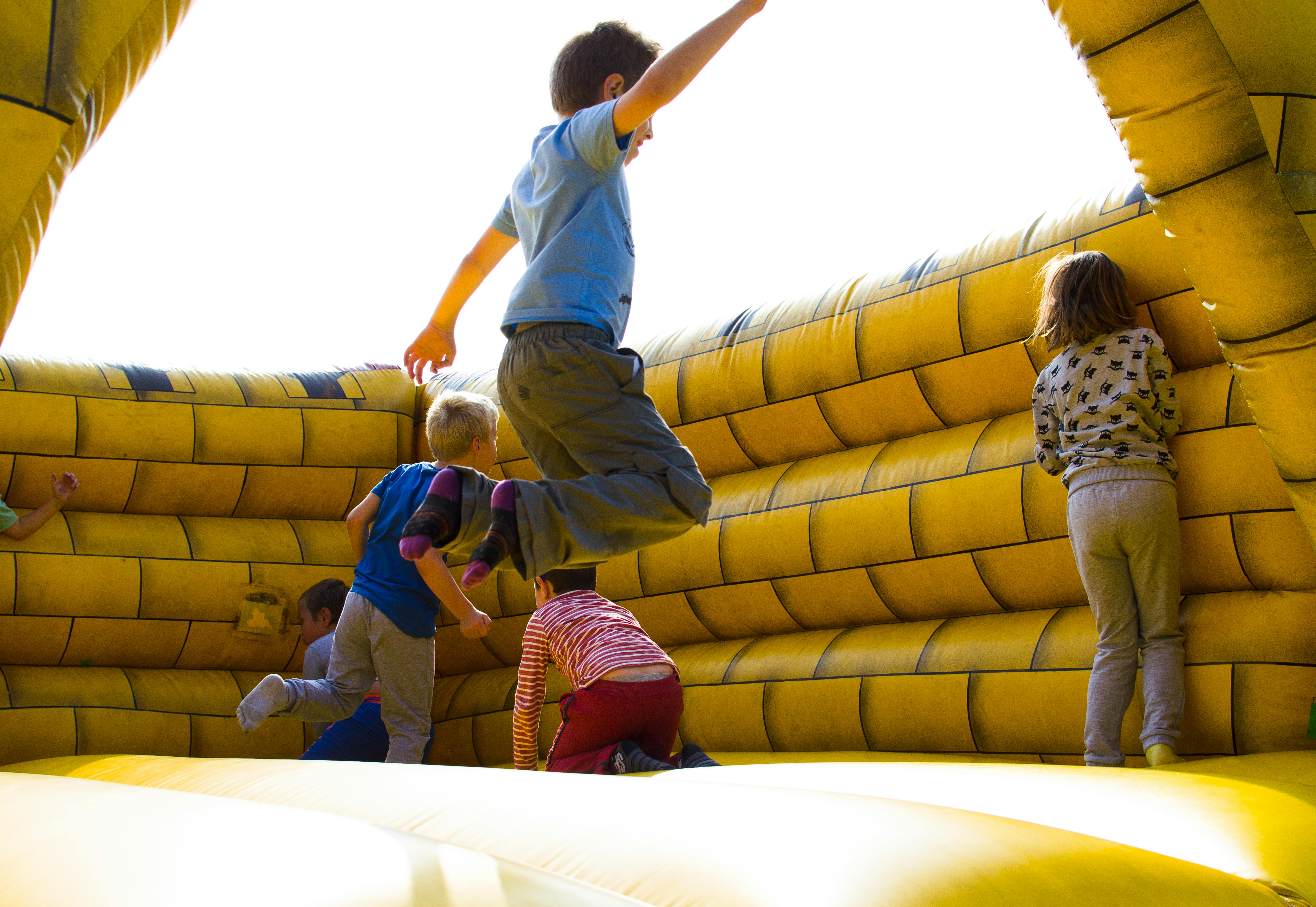 Kids jumping in a bounce house