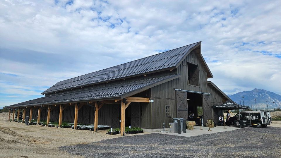 A grey livestock barn.