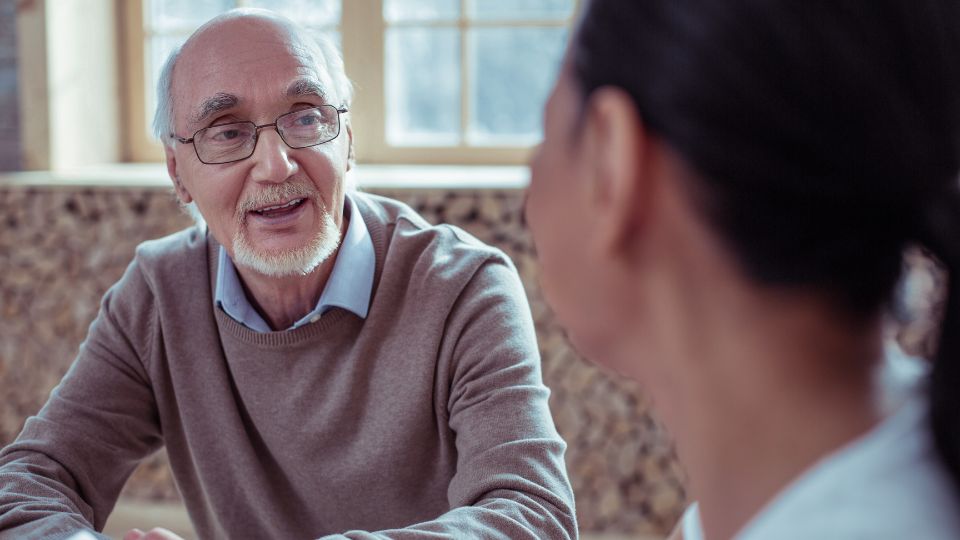 Older man talks with a doctor