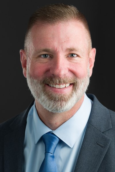 Headshot of Justen Smith.