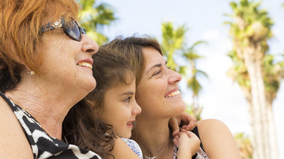 An image of two women and a young girl