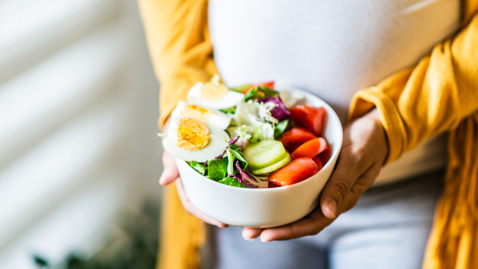 A prepared health bowl of food such as vegetables and hard boiled eggs