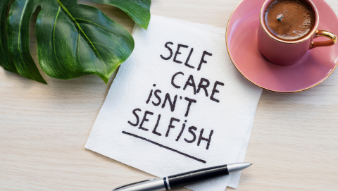 self care isn't selfish written on a napkin