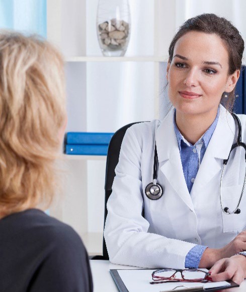 A doctor talking to a patient.