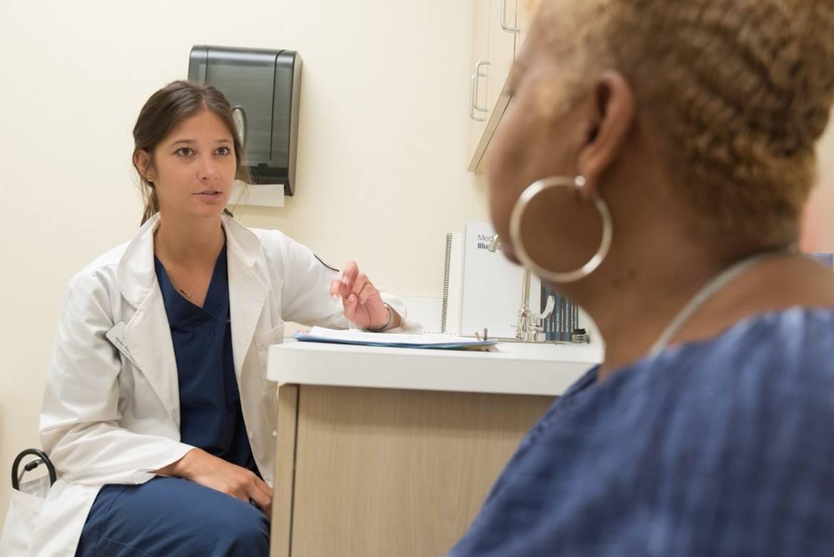 A doctor and a women talking.