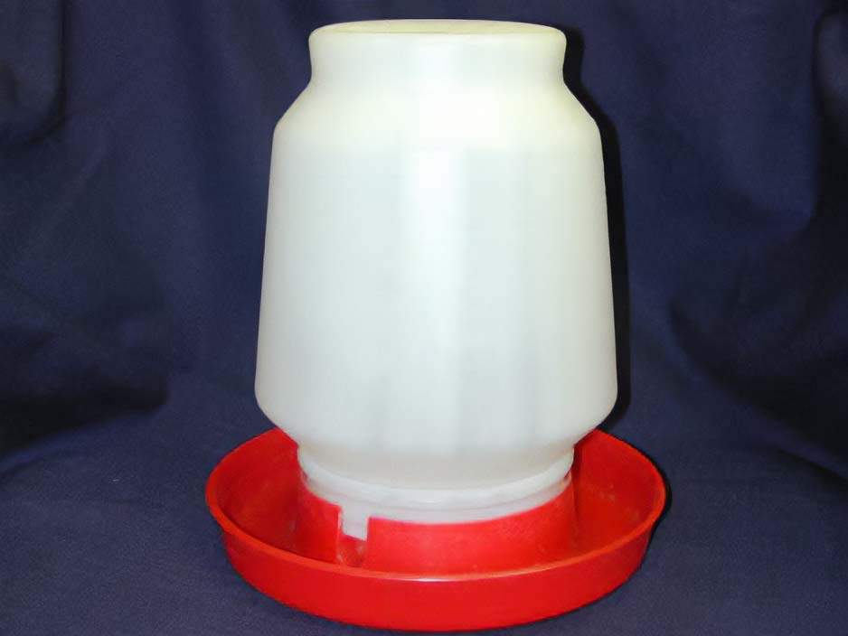 White plastic reservoir screwed into a shallow red base ring.