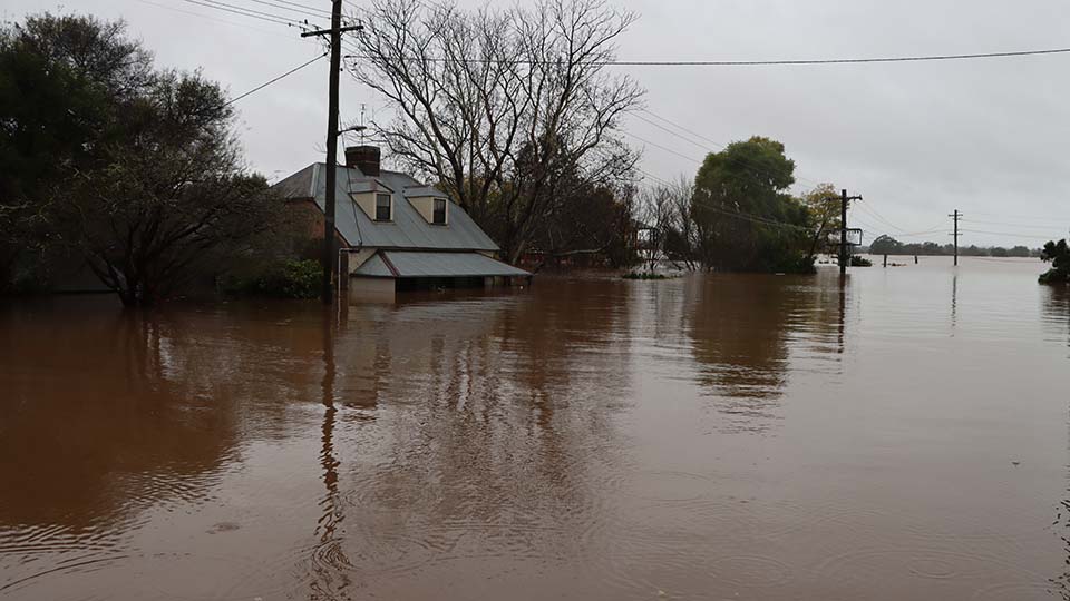House in high flood water as far as eye can see