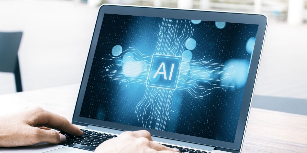 Person using AI on laptop