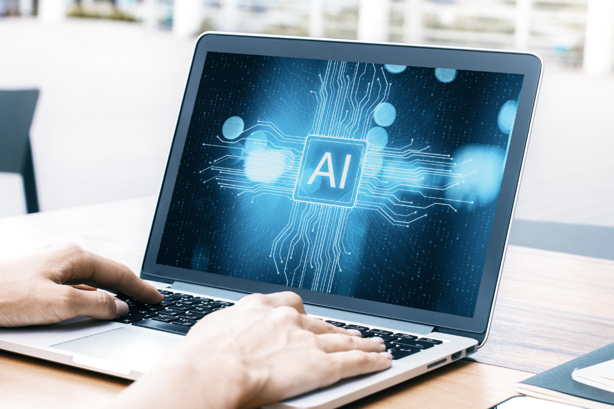 Person using AI on laptop