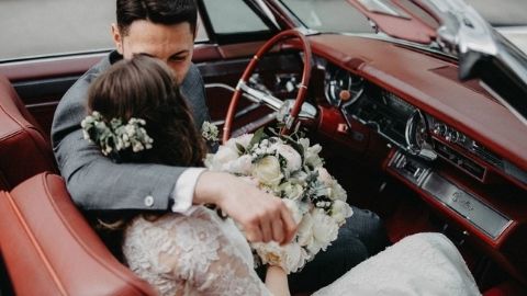 wedded couple in car
