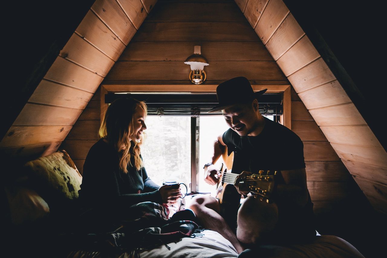 couple playing guitar
