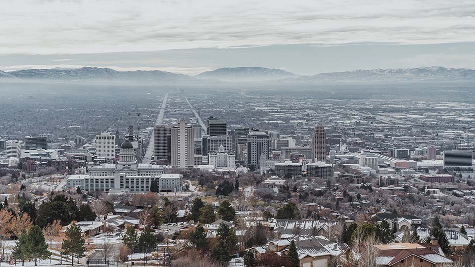Winter view of Salt Lake City from above state capitol building with hazy air conditions