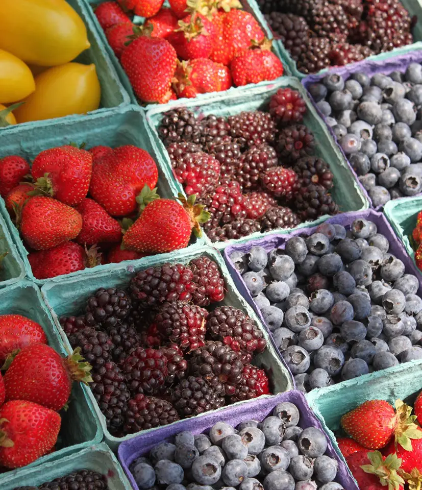 Assorted berries at a market stand