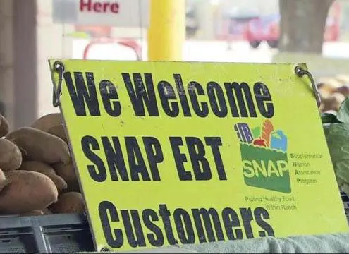 Sign at market that says We Welcome SNAP EBT Customers