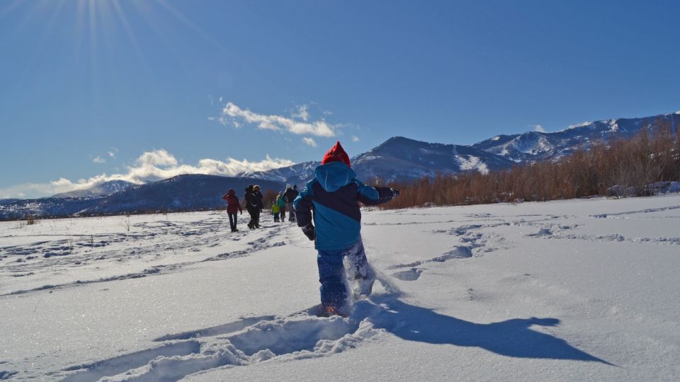 Child running in snowshoes