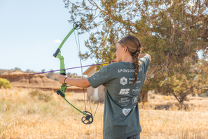 Youth shooting a bow and arrow