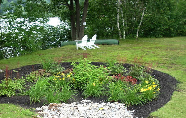 Rainscaping in a yard with a flower bed.