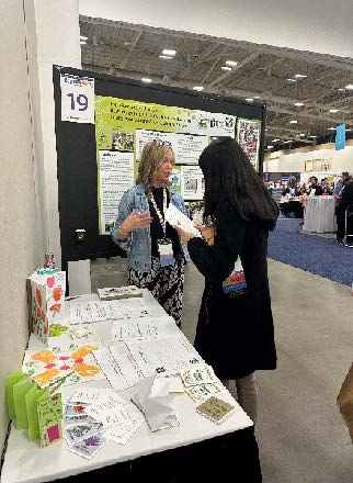 Two women by a display booth.
