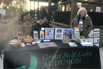 Two elderly women sitting at a salt lake audubon table